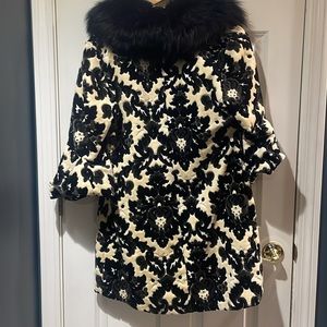 Black and tan ornate design. With black faux trim around the collar